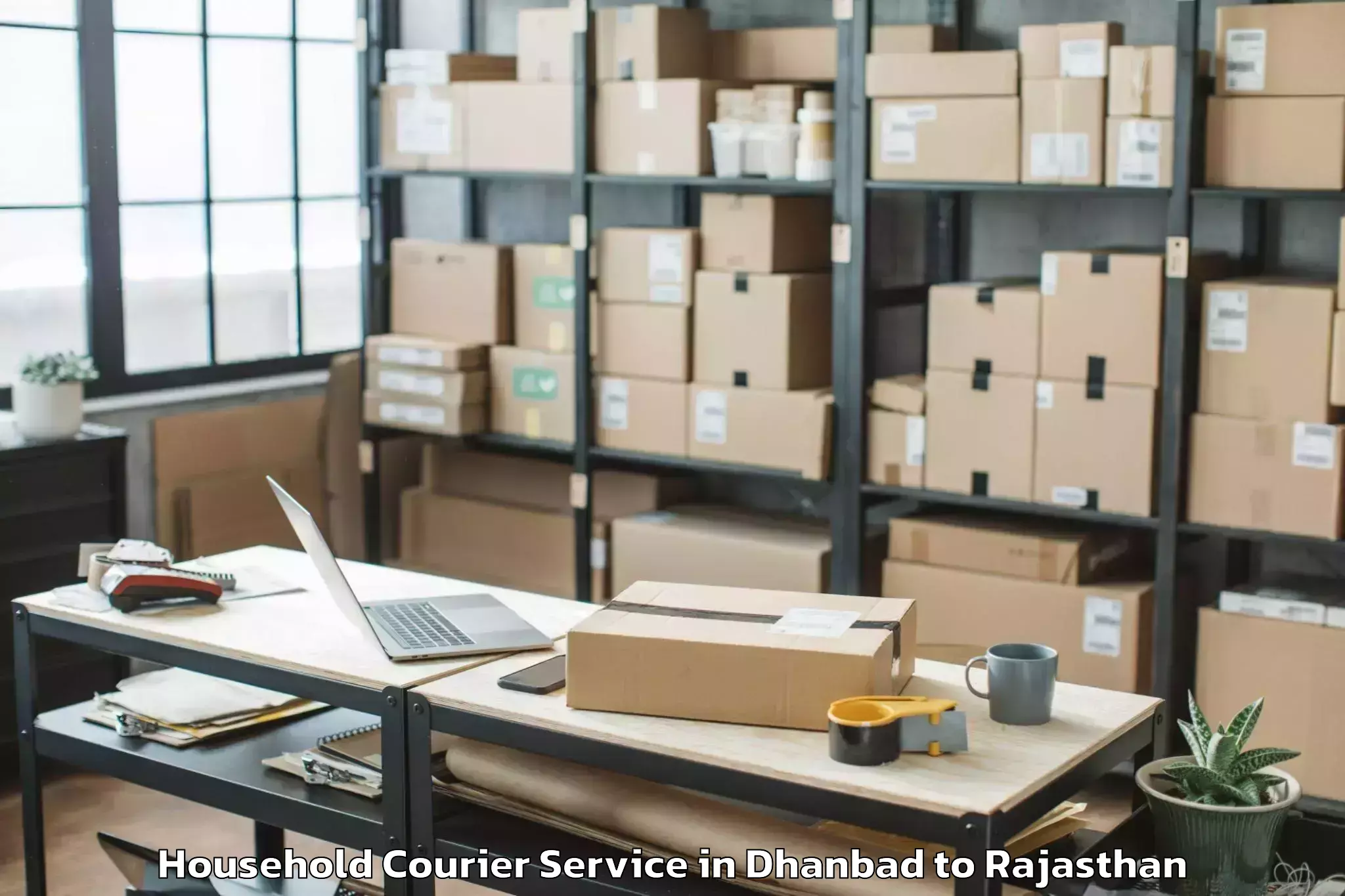 Book Dhanbad to Padampur Household Courier